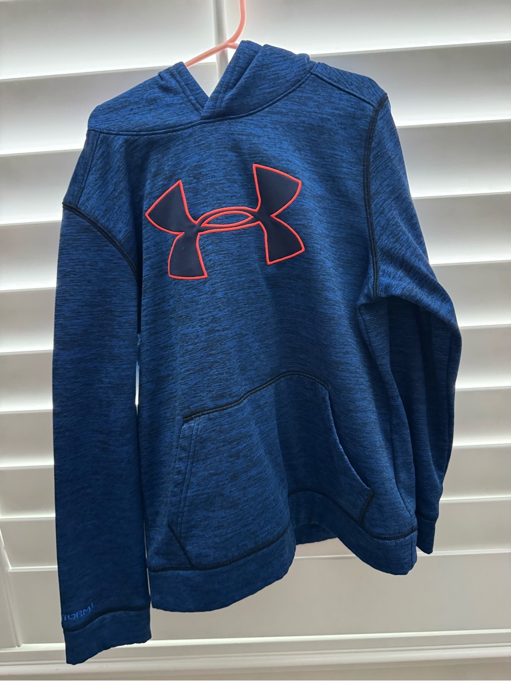 Youth Boys Under Armour Blue Hoodie with Orange outlined logo